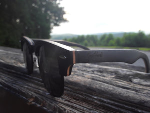 black skateboard wood sunglasses side view
