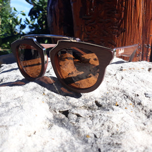 cherry wood with silver metal frame sunglasses  outside