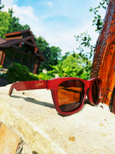 Load image into Gallery viewer, Crimson wood sunglasses outdoors