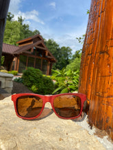Load image into Gallery viewer, crimson wooden sunglasses front view outdoors