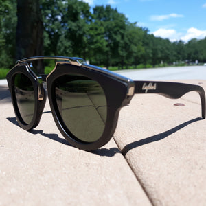 black wood with silver metal frame sunglasses in the sun