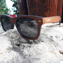 Load image into Gallery viewer, Red stripe bamboo sunglasses outdoors quarter front view