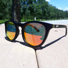 Load image into Gallery viewer, outdoors view of red lens sunglasses